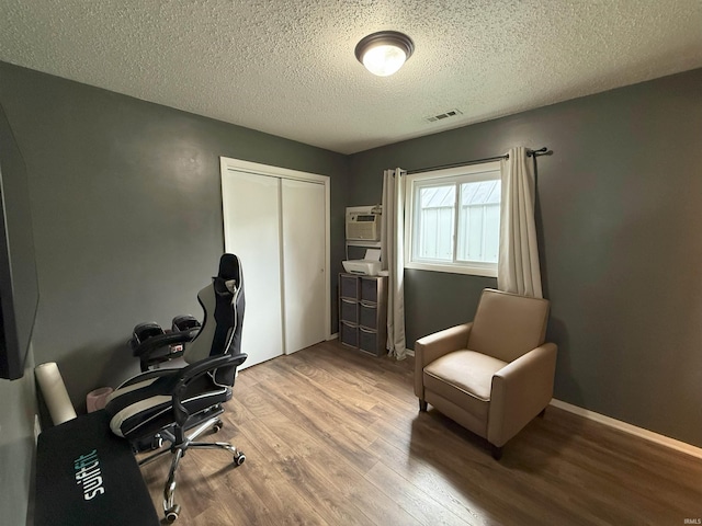 308 E Fourth St, North Webster, IN 46555 - office area featuring wood finished floors and a textured ceiling