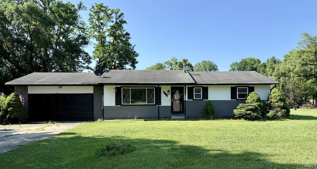 18460 Brewster Dr, Bristol, IN 46507 - ranch-style house with a garage, driveway, and a front lawn