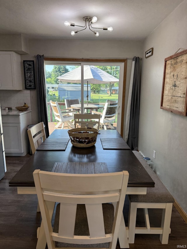 18460 Brewster Dr, Bristol, IN 46507 - dining space with dark wood-style flooring