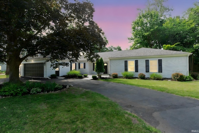1725 Rainbow Bend Blvd, Elkhart, IN 46514 - view of front of house with driveway, a lawn, and an attached garage