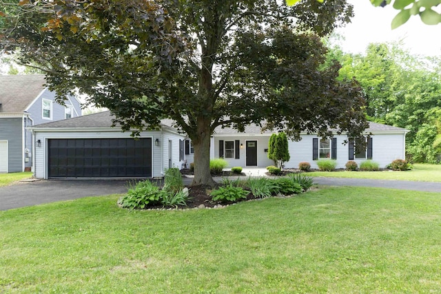 1725 Rainbow Bend Blvd, Elkhart, IN 46514 - view of property hidden behind natural elements featuring driveway, an attached garage, a front yard, and covered porch