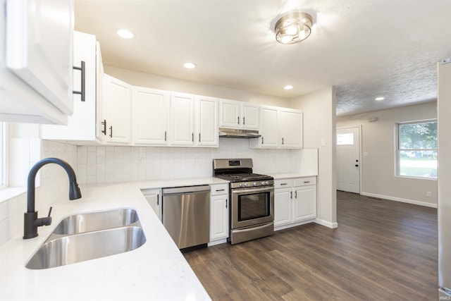 1725 Rainbow Bend Blvd, Elkhart, IN 46514 - kitchen featuring stainless steel appliances, under cabinet range hood, light countertops, white cabinetry, and recessed lighting