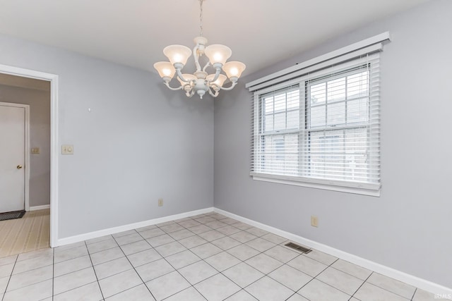 4301 W Friar Dr, Muncie, IN 47304 - unfurnished room with a chandelier, healthy amount of natural light, and light tile patterned flooring