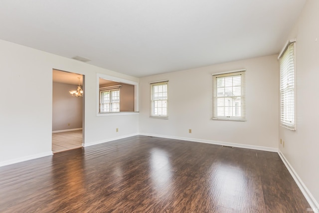 4301 W Friar Dr, Muncie, IN 47304 - unfurnished room with a chandelier and wood finished floors