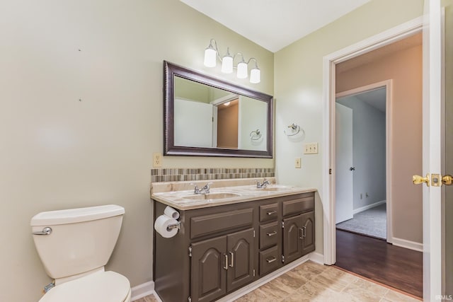 4301 W Friar Dr, Muncie, IN 47304 - bathroom with double vanity and toilet