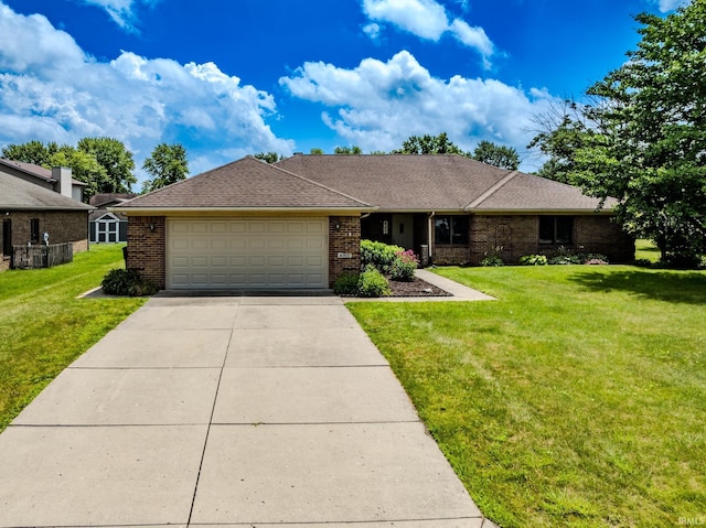 4301 W Friar Dr, Muncie, IN 47304 - single story home with an attached garage, brick siding, concrete driveway, and a front yard