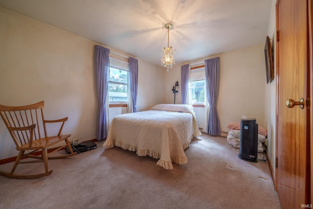 604 W 10th St, Jonesboro, IN 46938 - bedroom featuring multiple windows, light carpet, a chandelier, and a baseboard radiator
