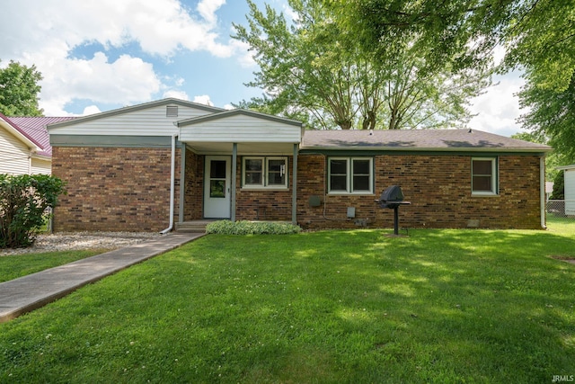 604 W 10th St, Jonesboro, IN 46938 - single story home with a front lawn and brick siding