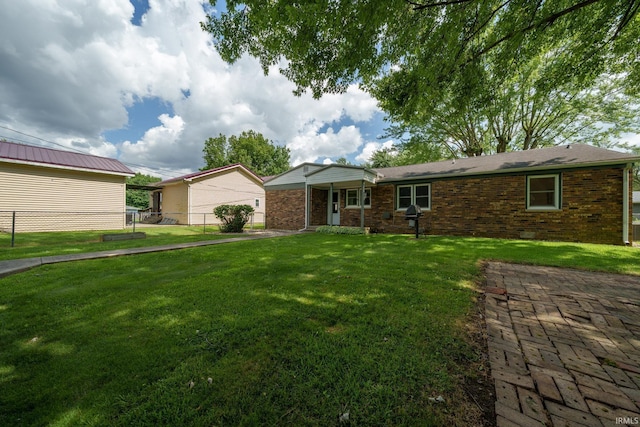 604 W 10th St, Jonesboro, IN 46938 - view of front facade featuring brick siding and a garage