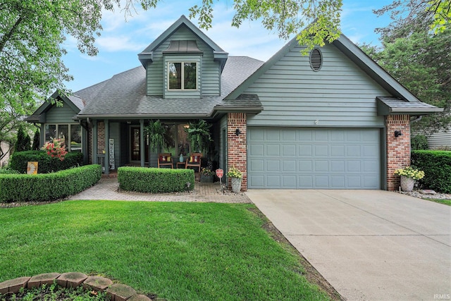 54454 Heron Cove Ln, Elkhart, IN 46516 - view of front of home featuring brick siding, concrete driveway, a front yard, an attached garage, and a shingled roof