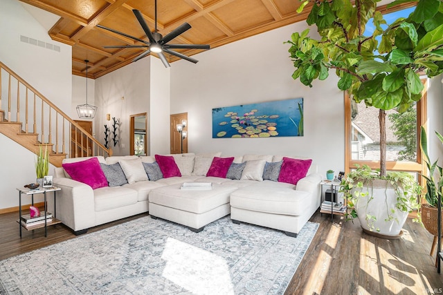 54454 Heron Cove Ln, Elkhart, IN 46516 - living room featuring wood finished floors, coffered ceiling, ceiling fan, stairway, and a towering ceiling