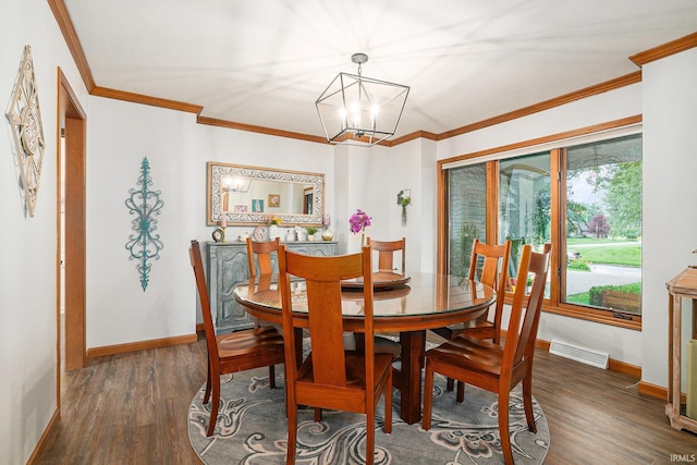 54454 Heron Cove Ln, Elkhart, IN 46516 - dining room with wood finished floors, crown molding, and a chandelier