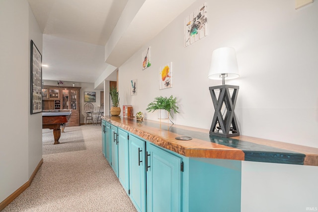 54454 Heron Cove Ln, Elkhart, IN 46516 - kitchen with blue cabinetry, billiards table, and light carpet