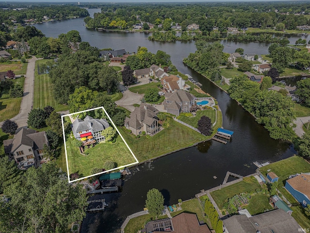 54454 Heron Cove Ln, Elkhart, IN 46516 - aerial view of residential area with a large body of water and property parcel outlined