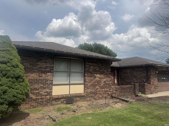 3404 Candy Ln, Kokomo, IN 46902 - view of property exterior featuring brick siding, a shingled roof, and a garage