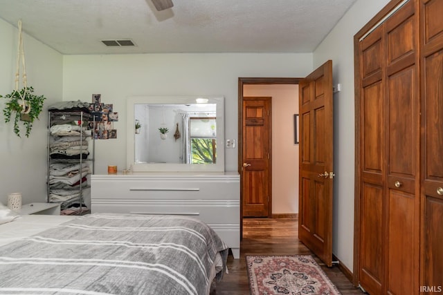 4365 N Maple Grove Rd, Bloomington, IN 47404 - bedroom with dark wood-type flooring, a closet, and ceiling fan