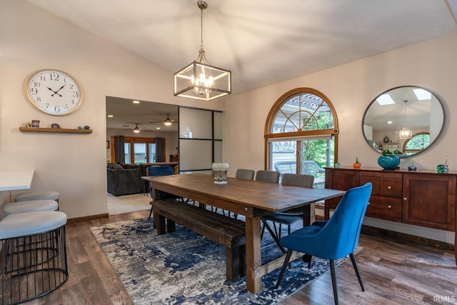 4365 N Maple Grove Rd, Bloomington, IN 47404 - dining room with a chandelier, wood finished floors, lofted ceiling, and ceiling fan
