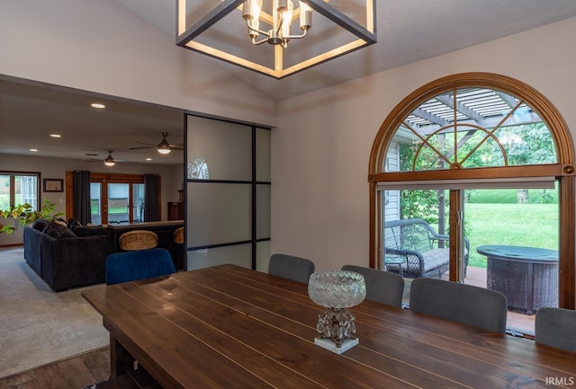 4365 N Maple Grove Rd, Bloomington, IN 47404 - dining space featuring wood finished floors, recessed lighting, a chandelier, and a ceiling fan
