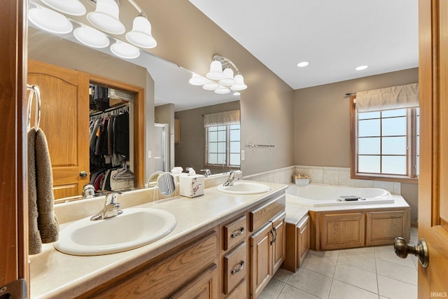 14920 Jasmine Key Ct, Fort Wayne, IN 46814 - full bath featuring tile patterned flooring, a bath, double vanity, a walk in closet, and recessed lighting