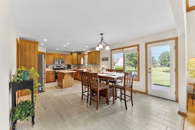 14920 Jasmine Key Ct, Fort Wayne, IN 46814 - dining space featuring recessed lighting, light wood finished floors, and a chandelier