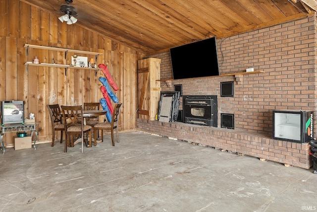 10227 E 500 S, Otterbein, IN 47970 - unfurnished living room with vaulted ceiling, wood walls, wooden ceiling, and a ceiling fan