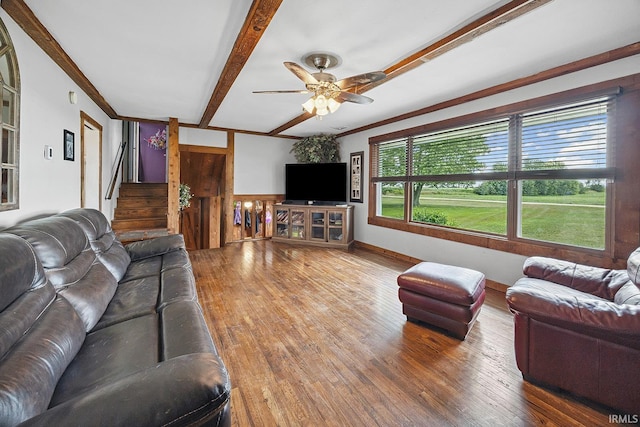 10227 E 500 S, Otterbein, IN 47970 - living room with wood finished floors, a ceiling fan, beam ceiling, stairway, and a wainscoted wall