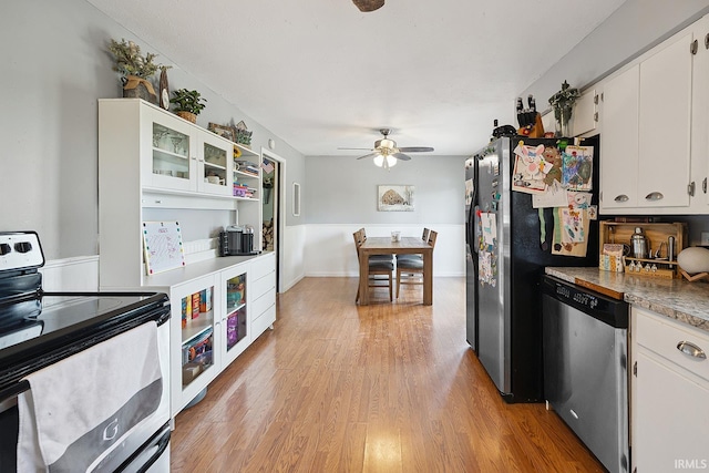 10227 E 500 S, Otterbein, IN 47970 - kitchen featuring appliances with stainless steel finishes, white cabinets, light wood-style flooring, a ceiling fan, and glass insert cabinets
