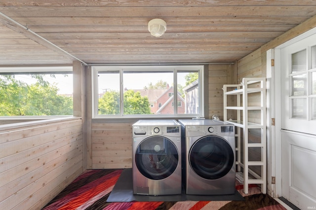 1144 N Warwick Rd, Muncie, IN 47304 - laundry room featuring washer and clothes dryer, wooden ceiling, and wood walls