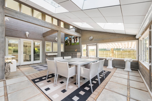 1144 N Warwick Rd, Muncie, IN 47304 - sunroom with wooden walls, healthy amount of natural light, lofted ceiling, and a skylight