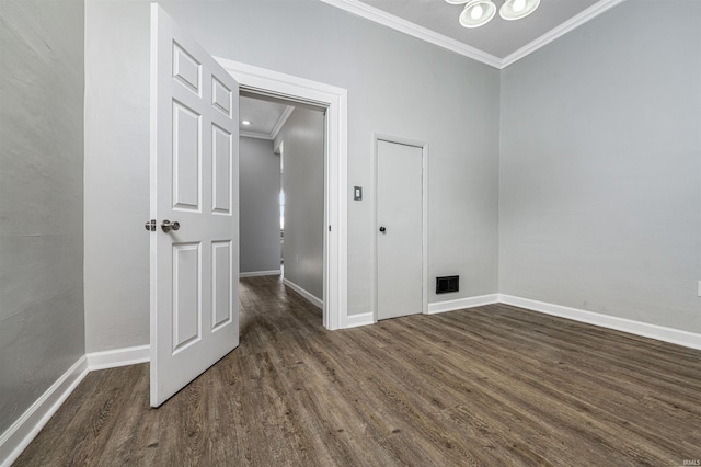 113 E High St, Redkey, IN 47373 - spare room featuring ornamental molding, dark wood finished floors, and a chandelier