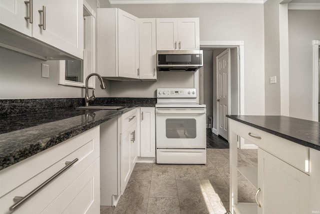 113 E High St, Redkey, IN 47373 - kitchen featuring electric stove, stainless steel microwave, and white cabinets