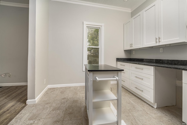 113 E High St, Redkey, IN 47373 - kitchen featuring crown molding and white cabinets