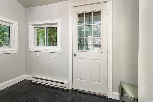 113 E High St, Redkey, IN 47373 - doorway to outside with a baseboard radiator and dark wood-type flooring