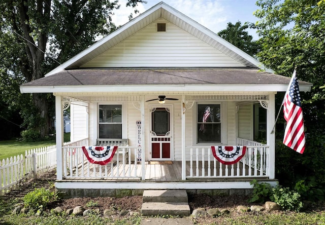 113 E High St, Redkey, IN 47373 - view of front of property featuring covered porch, a ceiling fan, and a shingled roof