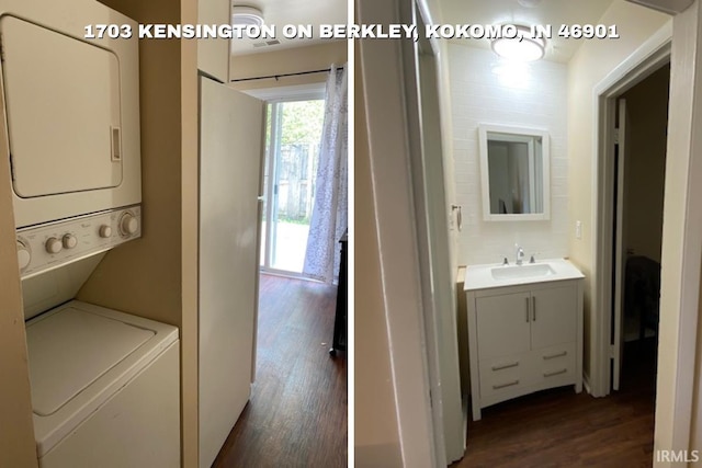 1403 Dunham On Berkley, Kokomo, IN 46901 - laundry area with stacked washer and clothes dryer and dark wood-type flooring
