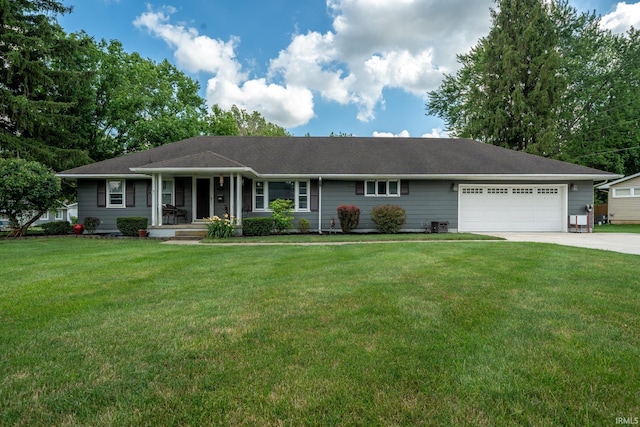 401 W Third St, Fairmount, IN 46928 - ranch-style home with covered porch, driveway, a garage, and a front lawn