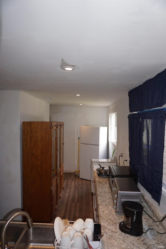 1628 E Division St, Evansville, IN 47711 - kitchen featuring freestanding refrigerator and dark wood-style floors