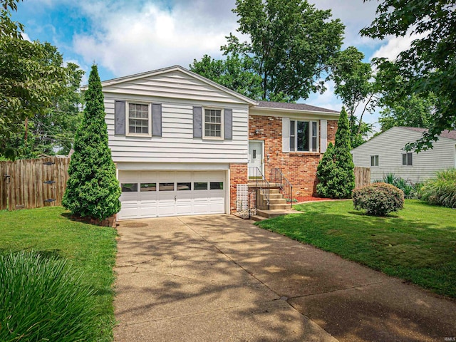 1313 Woodbine Ln, Evansville, IN 47710 - split foyer home featuring brick siding, an attached garage, and driveway