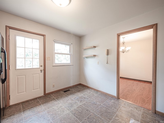 1313 Woodbine Ln, Evansville, IN 47710 - entryway with a chandelier and stone finish floors