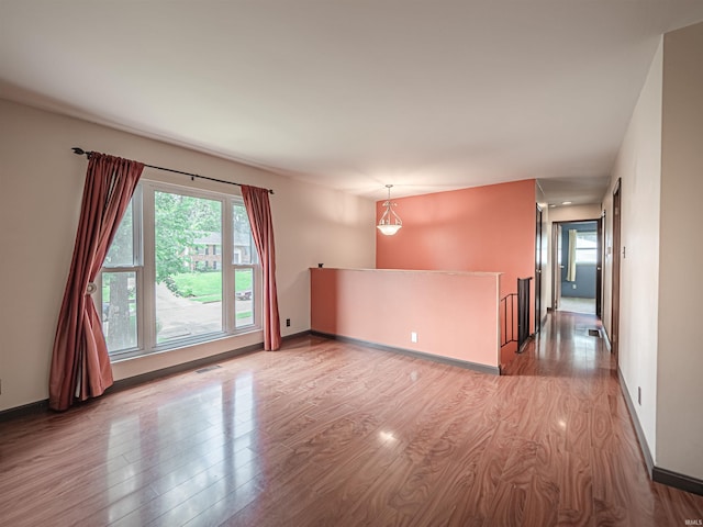 1313 Woodbine Ln, Evansville, IN 47710 - spare room with wood finished floors and plenty of natural light