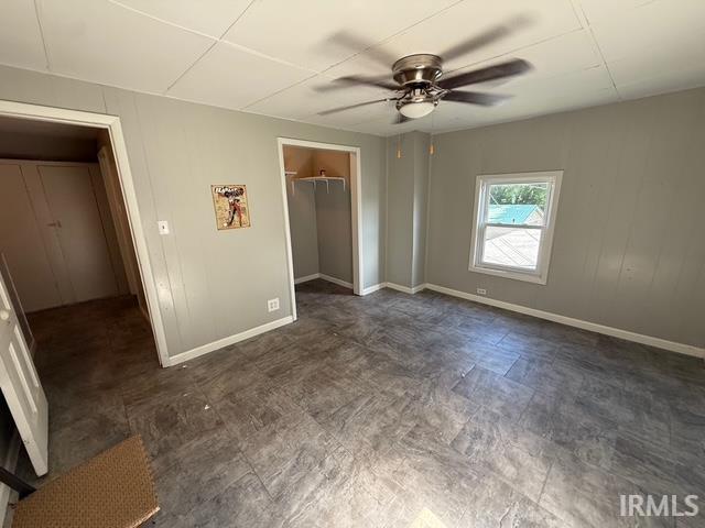 1021 W Franklin St, Evansville, IN 47710 - unfurnished bedroom featuring ceiling fan and a closet