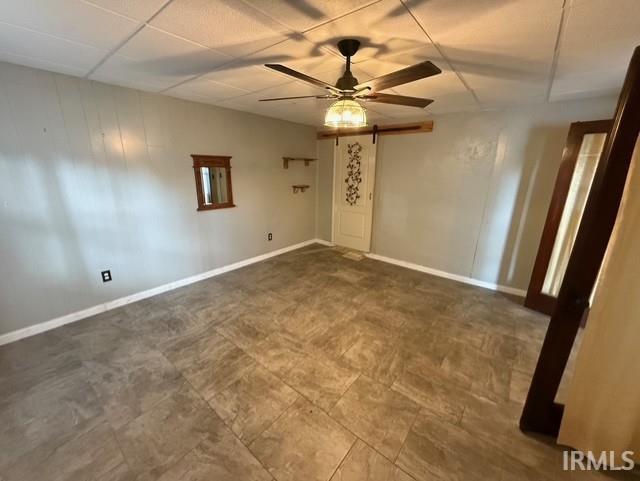 1021 W Franklin St, Evansville, IN 47710 - empty room with a ceiling fan and baseboards