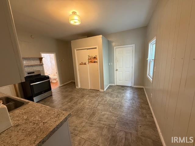 1021 W Franklin St, Evansville, IN 47710 - kitchen featuring stainless steel gas stove and a sink