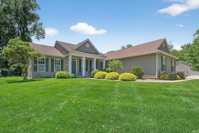 55359 Falling Water Dr, Elkhart, IN 46514 - view of front of property featuring a front yard, a shingled roof, and a porch