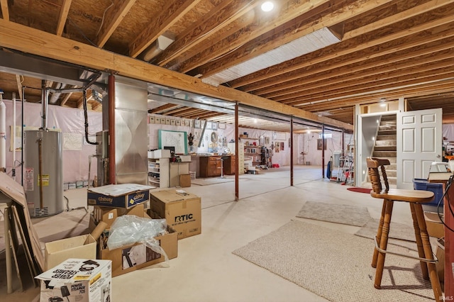55359 Falling Water Dr, Elkhart, IN 46514 - unfinished basement featuring water heater and stairway