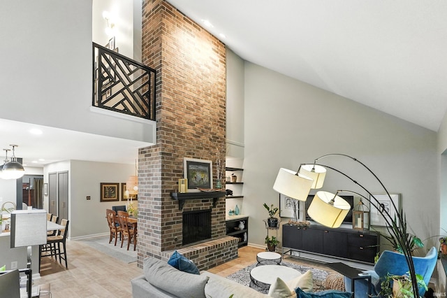 6756 Covington Creek Trl, Fort Wayne, IN 46804 - living room featuring high vaulted ceiling, wood finished floors, a fireplace, and recessed lighting