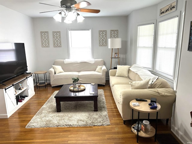 2109 E Gum St, Evansville, IN 47714 - living area featuring a ceiling fan and dark wood-style floors