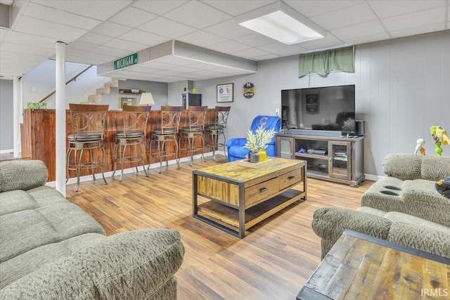 2607 Meadow Lark Ln, Evansville, IN 47720 - living area with a dry bar, a drop ceiling, wood finished floors, and stairs