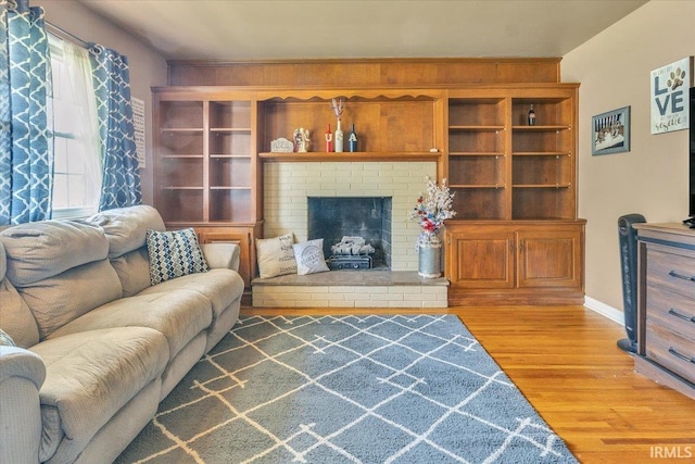 2607 Meadow Lark Ln, Evansville, IN 47720 - living room with wood finished floors and a brick fireplace