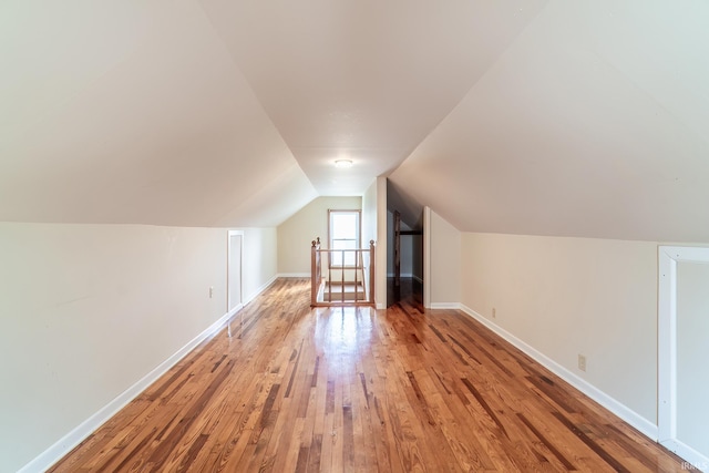 208 Chestnut St, Avilla, IN 46710 - bonus room with light wood-style flooring and vaulted ceiling